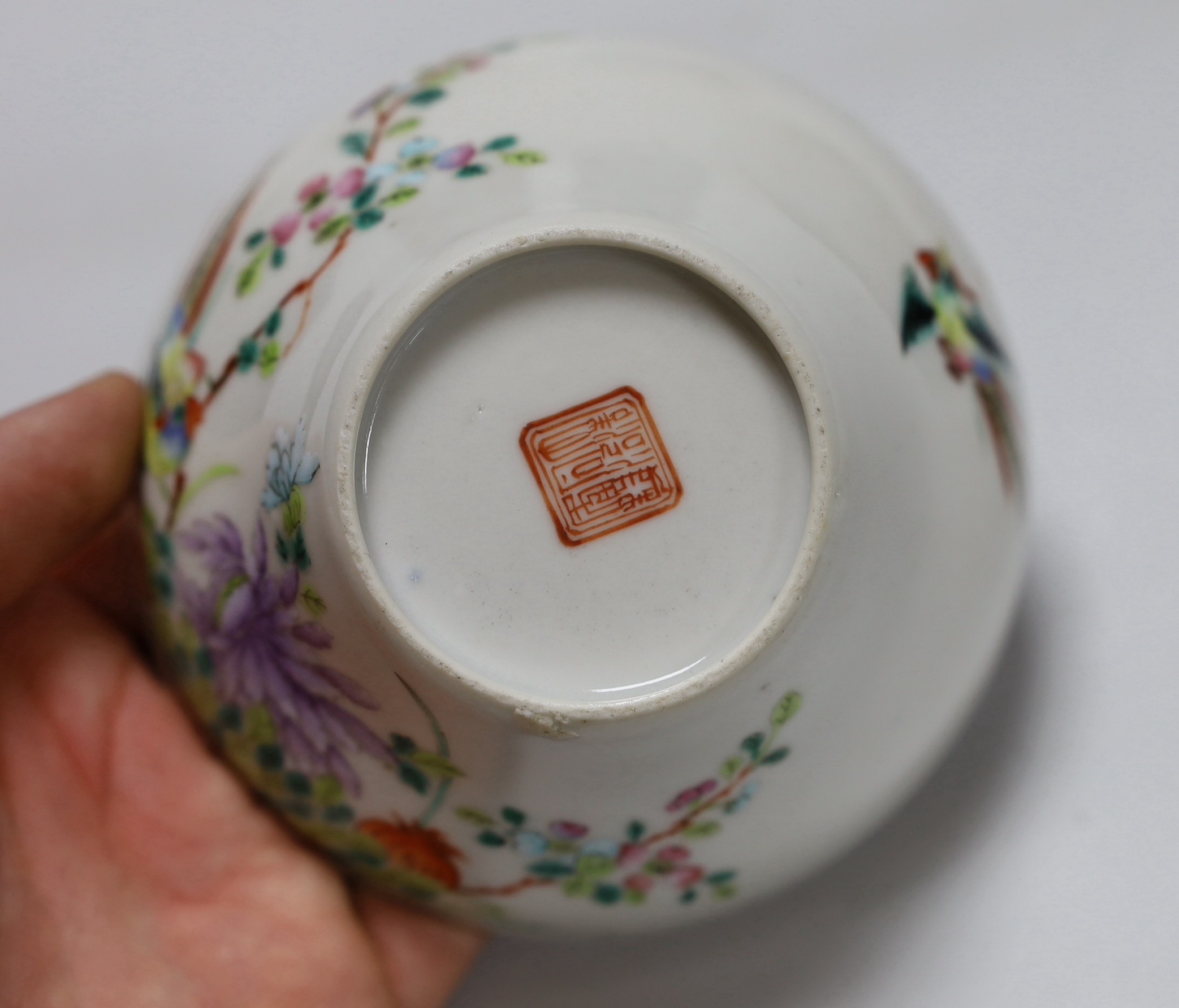 A Chinese blue and white saucer, together with a ‘dragon and phoenix’ saucer and a famille rose bowl